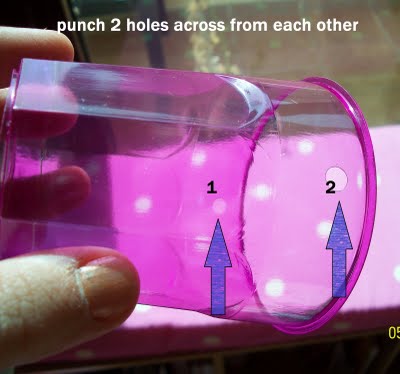 punch two holes in cup